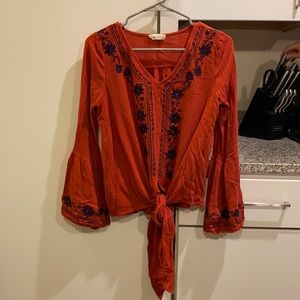 Altar’d State orange shirt.